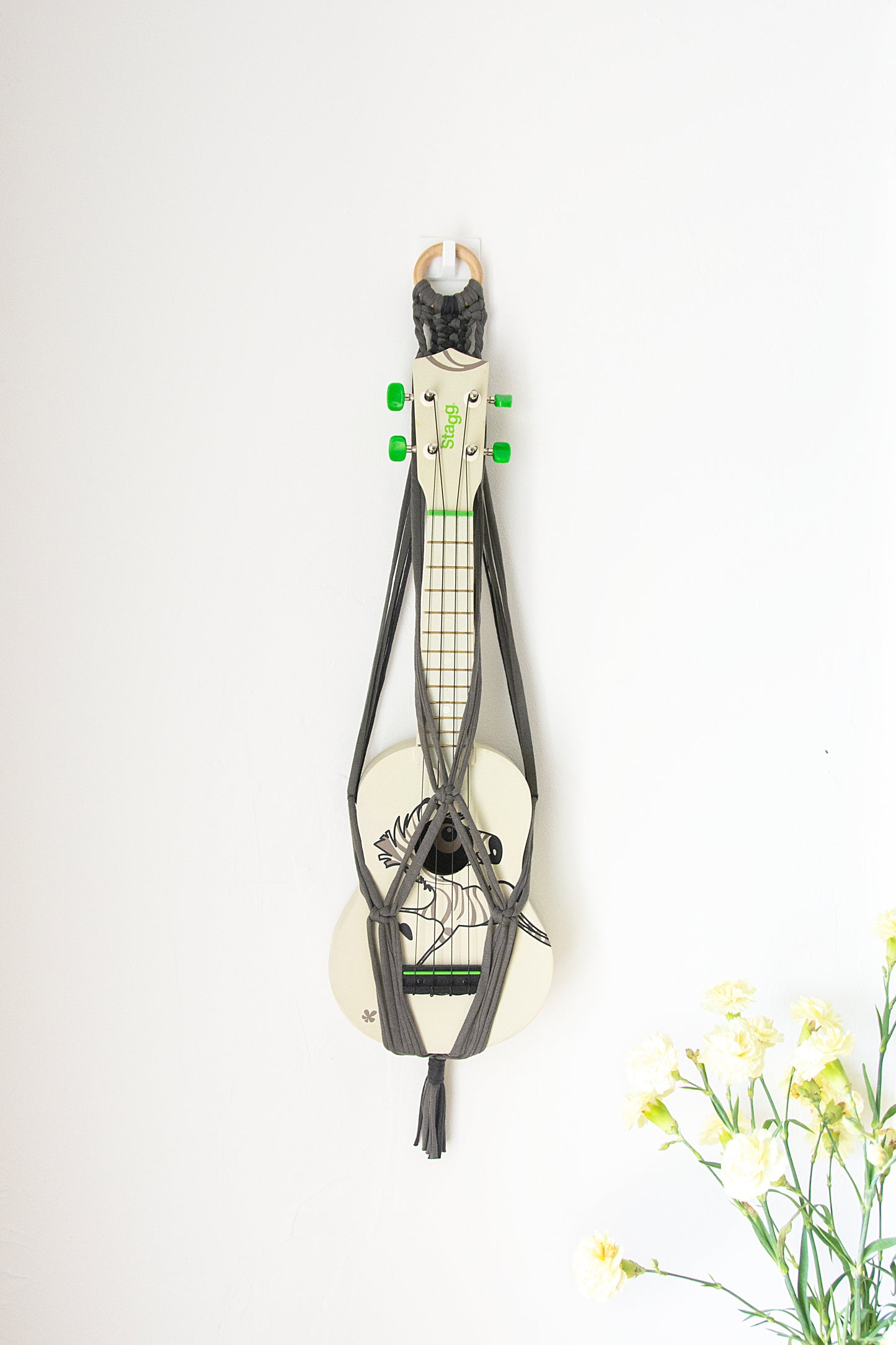 Grey ukulele hanger