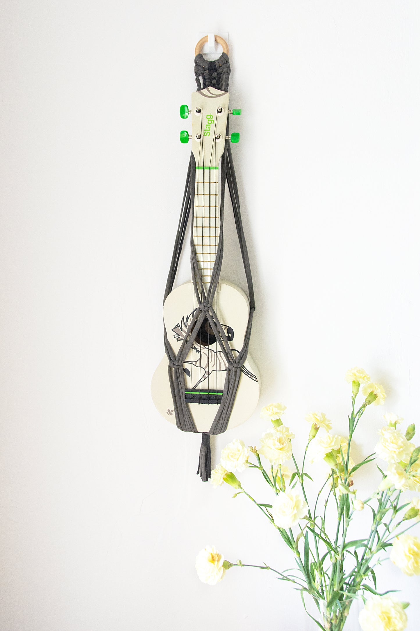Grey ukulele hanger